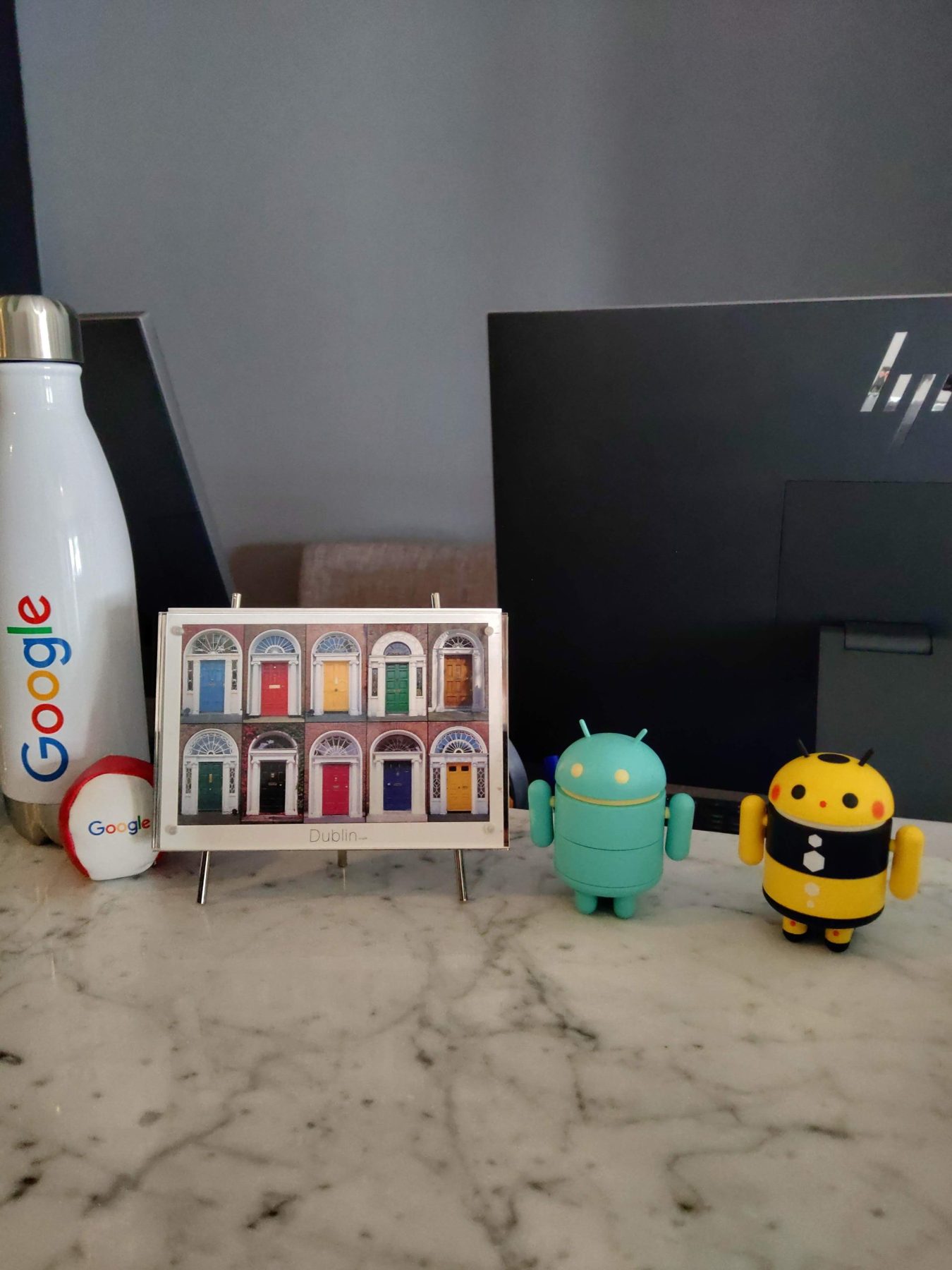 Dublin keepsake with a Google water bottle and Android collectibles on James's desk